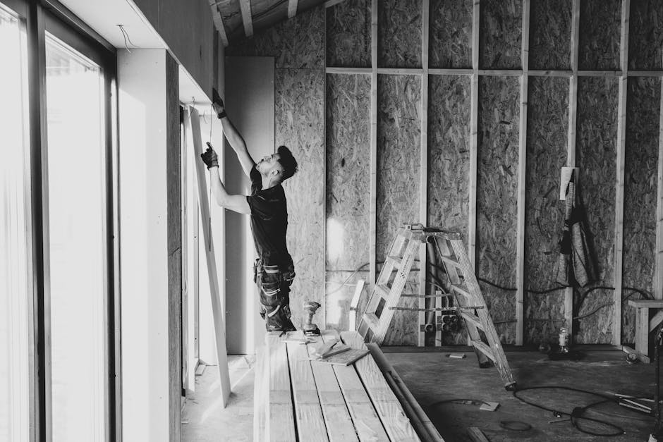 Professional contractor performing a window installation